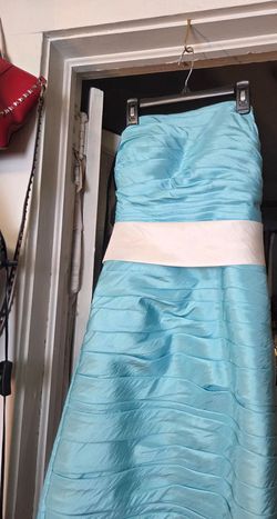 Beautiful light blue party dress with a white sash