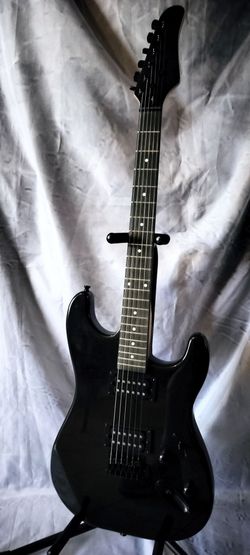 Brand new unbranded electric guitar with new bag cable and shoulder strap
