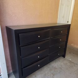 Black long dresser with 8 dresser