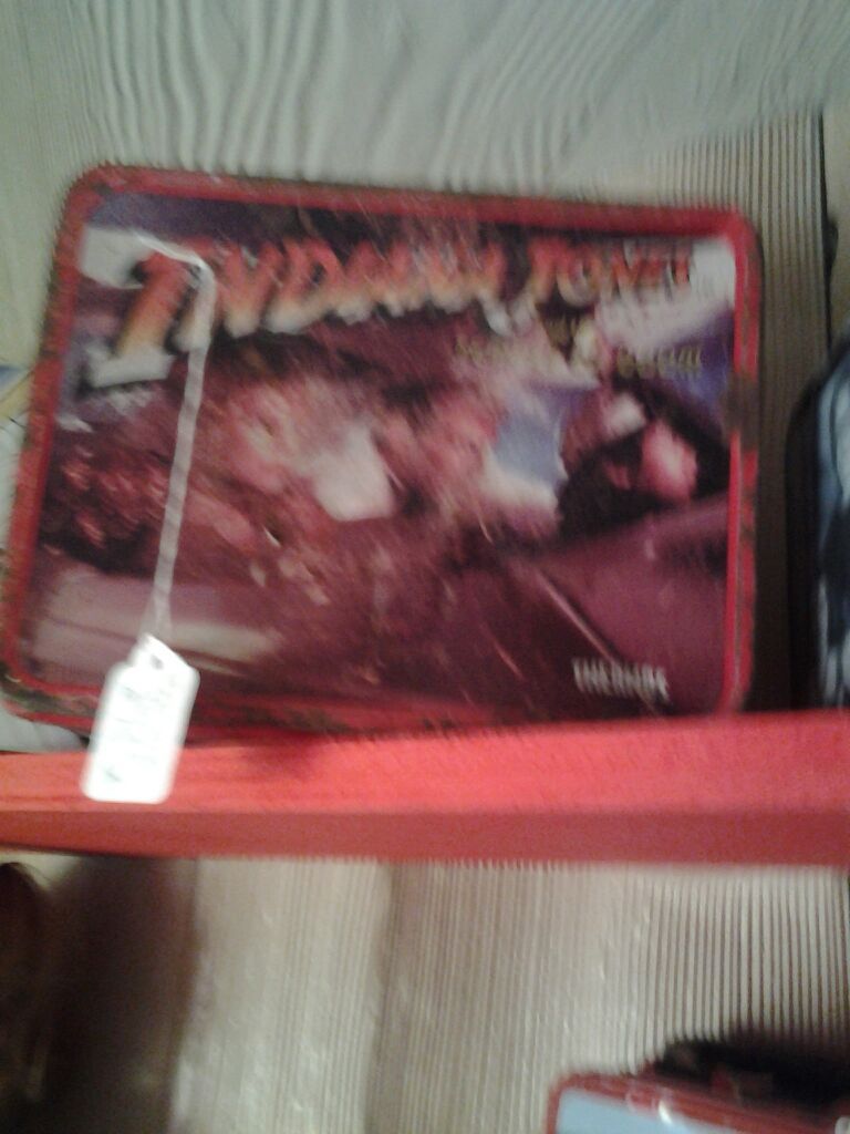 Old collectable metal Indiana Jones lunchbox used in rough shape