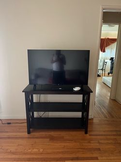 50 inch, TCL W/ remote, W/ TV stand