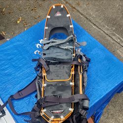 Lighting Ascent Snow Shoes with an REI backpack included.