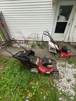 Two Toro Gas Push Lawn Mowers