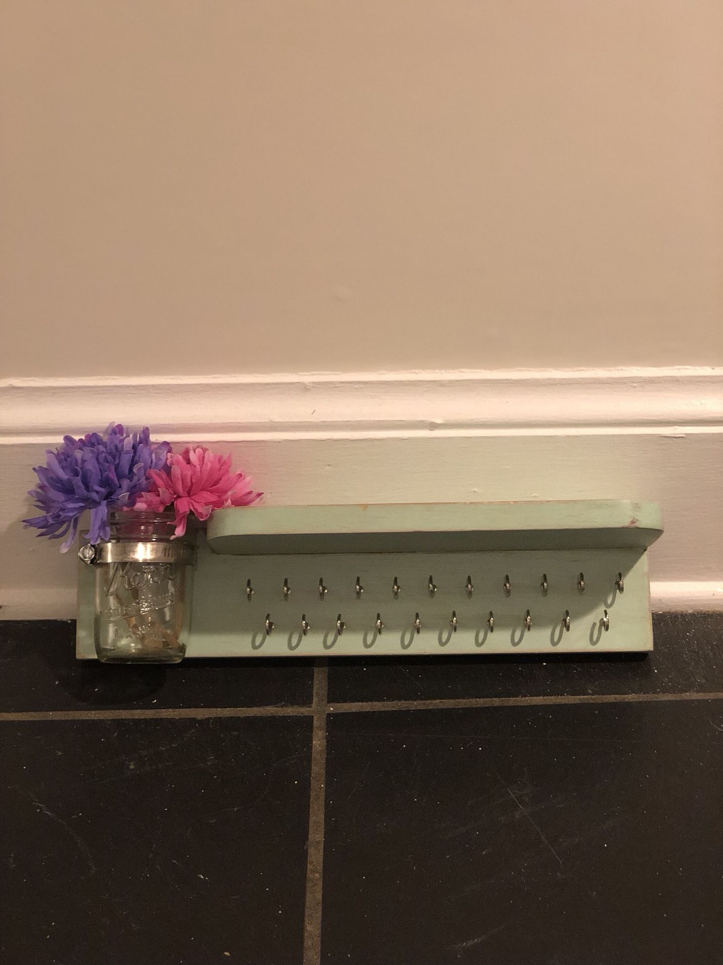 shelf with hooks and mason jar vase