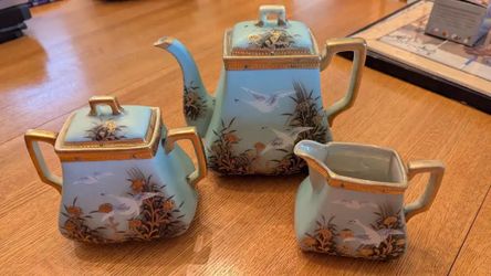 PORCELAIN WITH INTRICATE BIRD AND FLORAL DESIGN TEA SET