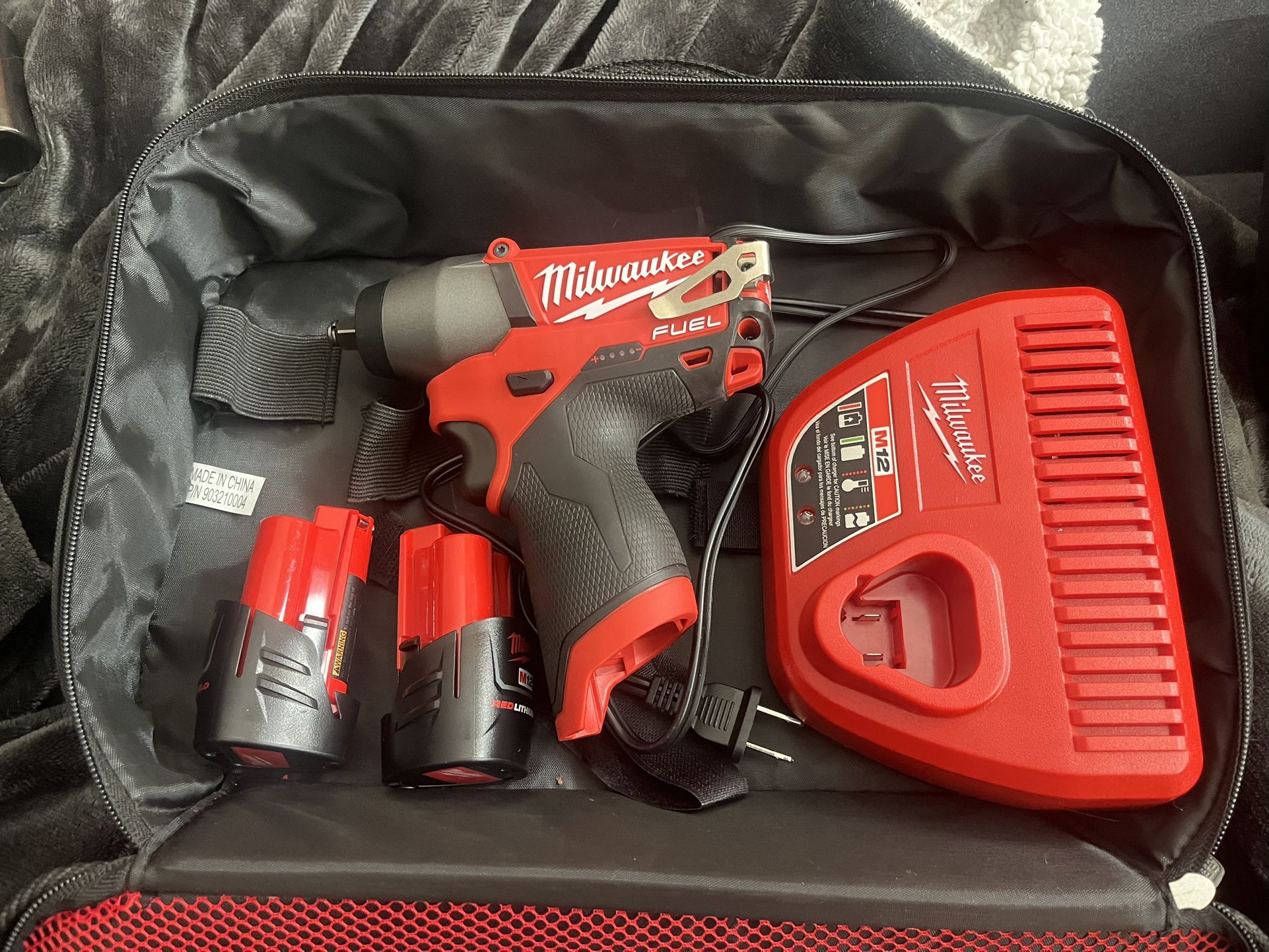 Milwaukee M12 3/8 Impact Wrench 2 Batteries And A Charger