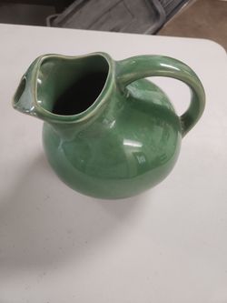 Green vintage ceramic pitcher
