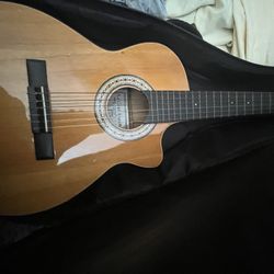 musical cedar brown acoustic guitar 