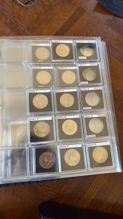 Collector album for half dollar, $14 worth coins included