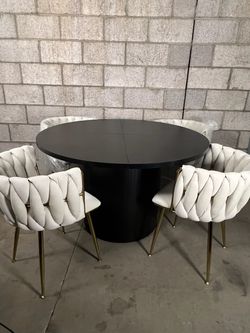 Black dining table with chairs