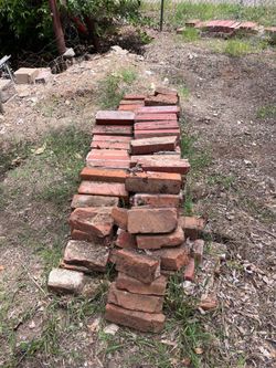 FREE ,red bricks, large cement trough and large metal roller ramps
