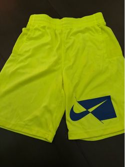 bright yellow Nike Dri-FIT youth training shorts featuring a navy blue geometric graphic logo sz L