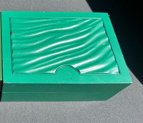 Rolex medium box.  Missing crown on front $70