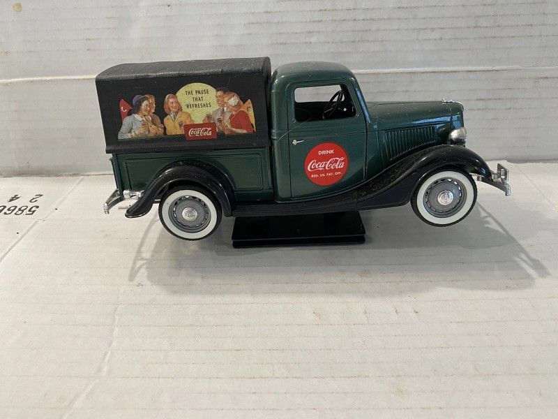Vintage Coca Cola Die Cast Red V8 Roadster Model With Stand Also A Coca Cola Green Pickup Truck Sold As A Pair Located In Palm Springs CA 