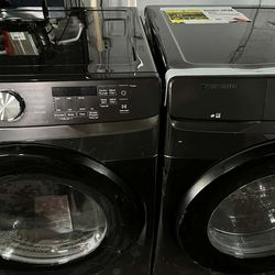 LG 4.5 Cu. Ft. Front Load Washer and 7.4 Cu. Ft. Electric Dryer with TurboWash 360 Laundry Pair in Black.