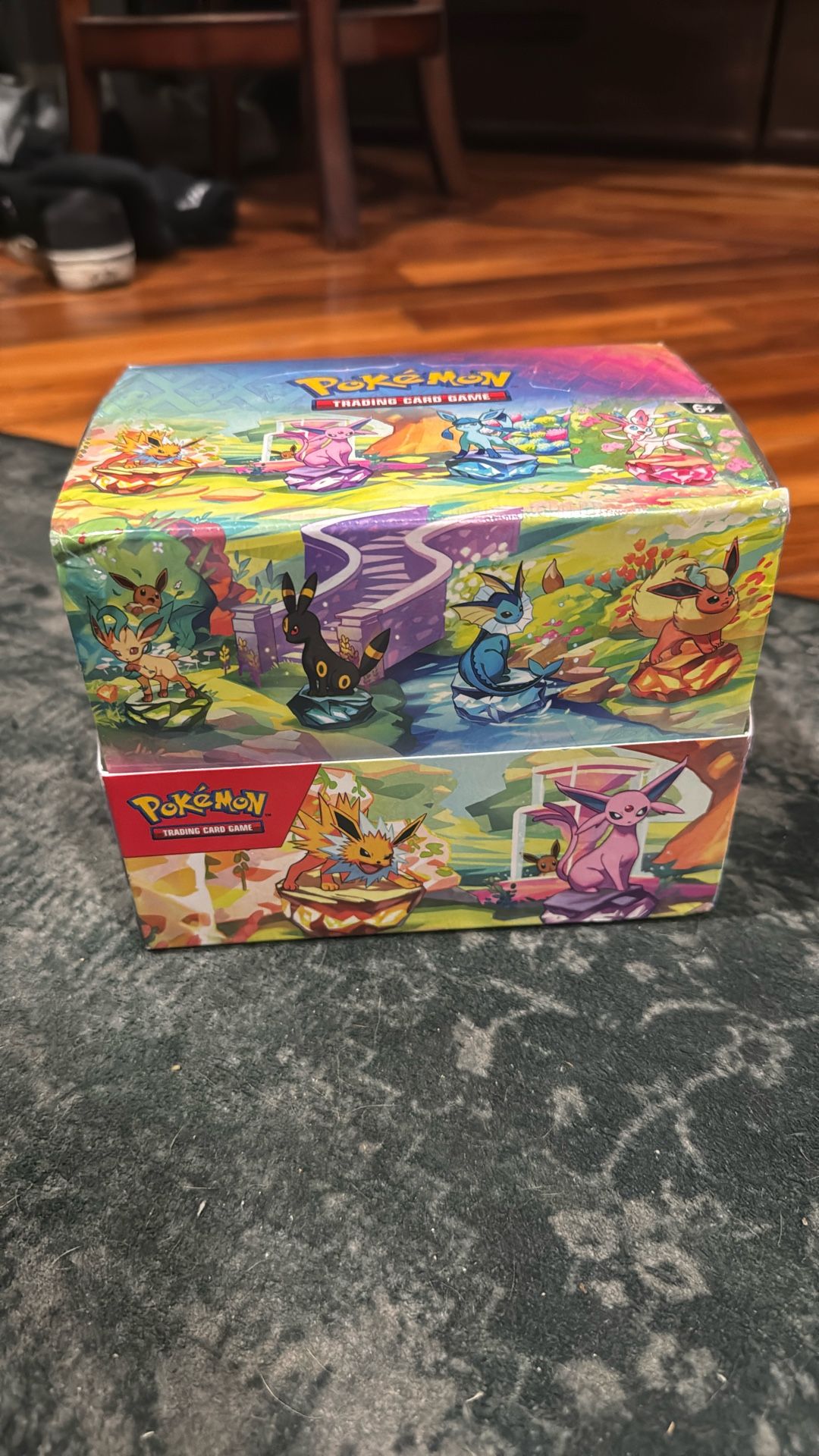 Prismatic Evolutions Sealed Tin Display