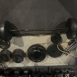 Curl Bar With About 300lbs Of Standard Weights 2 Dumbbells And A Extra Hammer Curl Bar