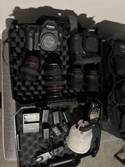 2 Cameras, 4 Lenses, 5 Batteries, One Charger, And One Hard Case