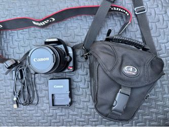 Canon Rebel XSi camera with 18-55mm lens . Charger , battery and camera bad included