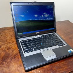 Dell Latitude D620 laptop with power adapter