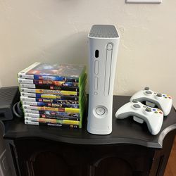 Xbox 360 Console with Two Controllers, power cable and 12 games. 