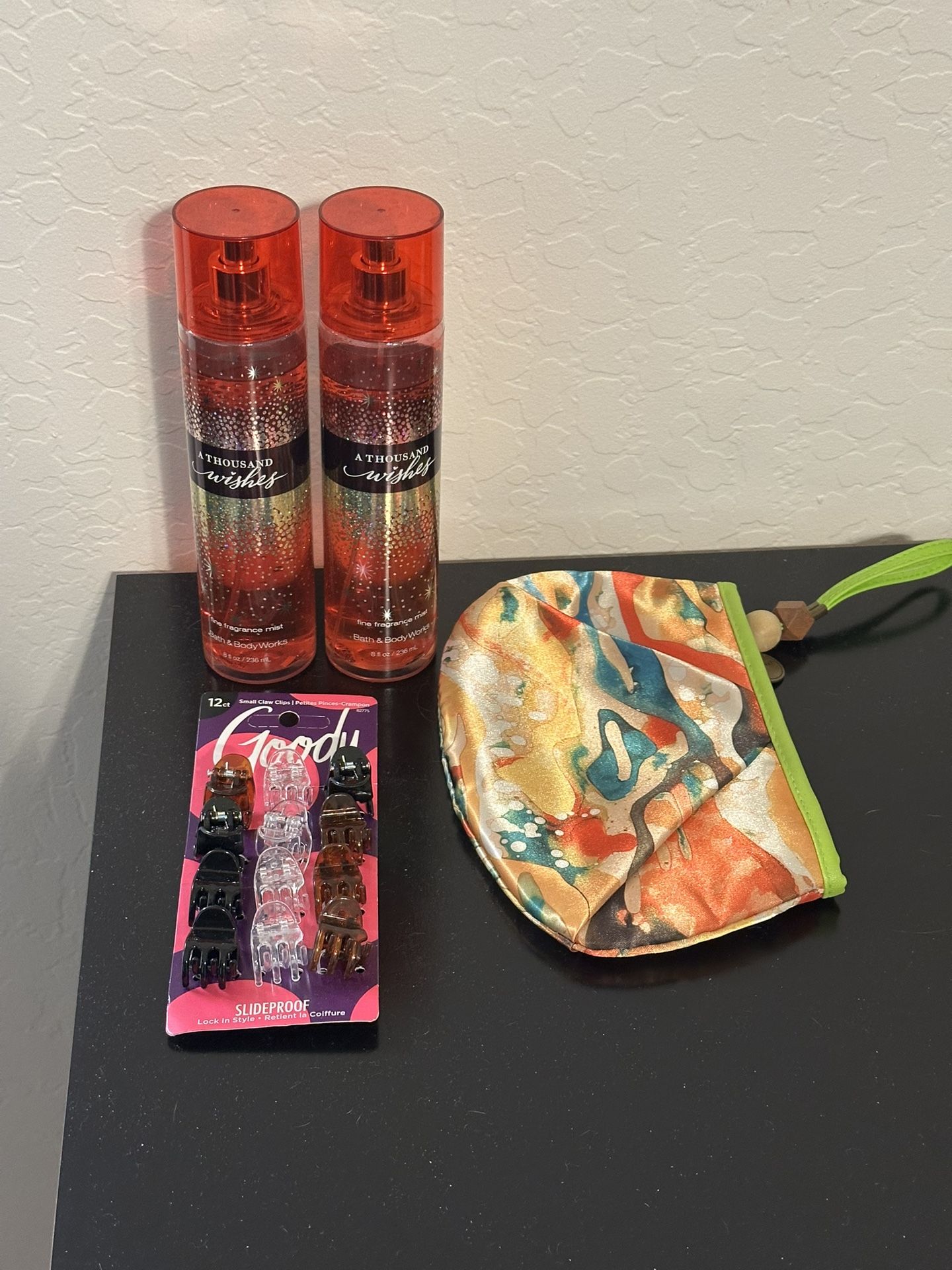 Perfume, tiny hair clips and toiletries bag