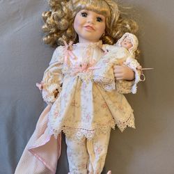 Victorian Porcelain Doll in Pajamas with baby doll