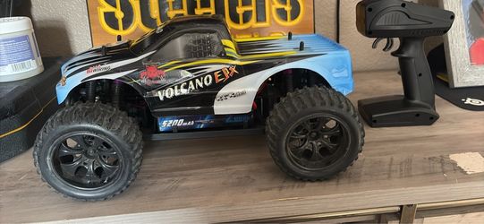 Red car racing volcano  4WD monster truck