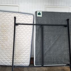 King bed, frame and metal box spring with cover.