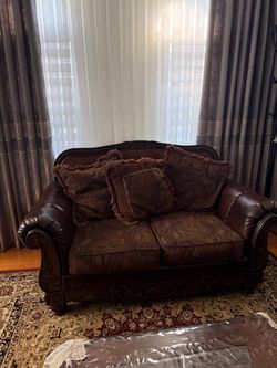 Ashley furniture living room set : sofa , loveseat and coffee table .