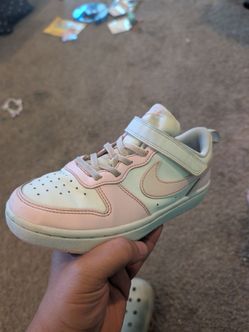 Pink and white Nike kids shoes