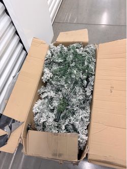 5 foot flocked Christmas tree barely used