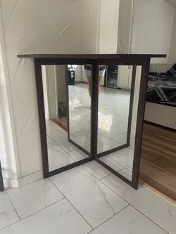 Wood accent table with mirror panels