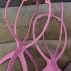 Two plastic wig holders