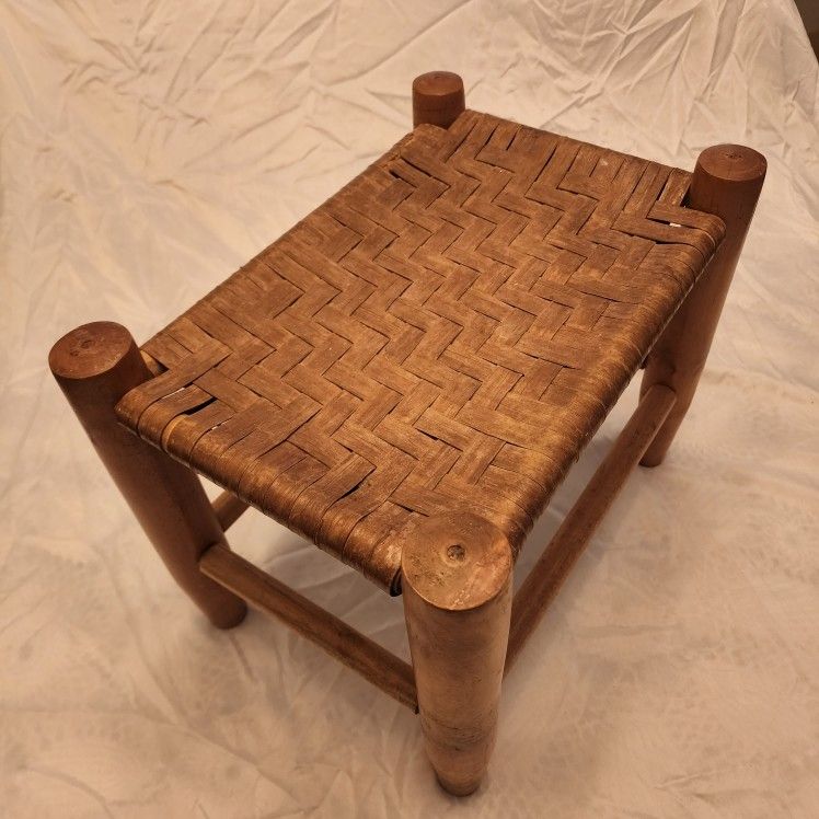 PRIMITIVE WOODEN FOOTSTOOL WITH BASKETWEAVE LEATHER SEAT
