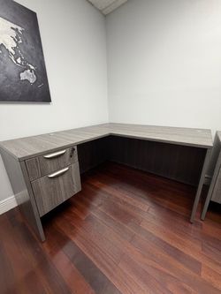 3 gray L-Shaped office desks, each in excellent condition. Great for a professional office, home office, or workspace