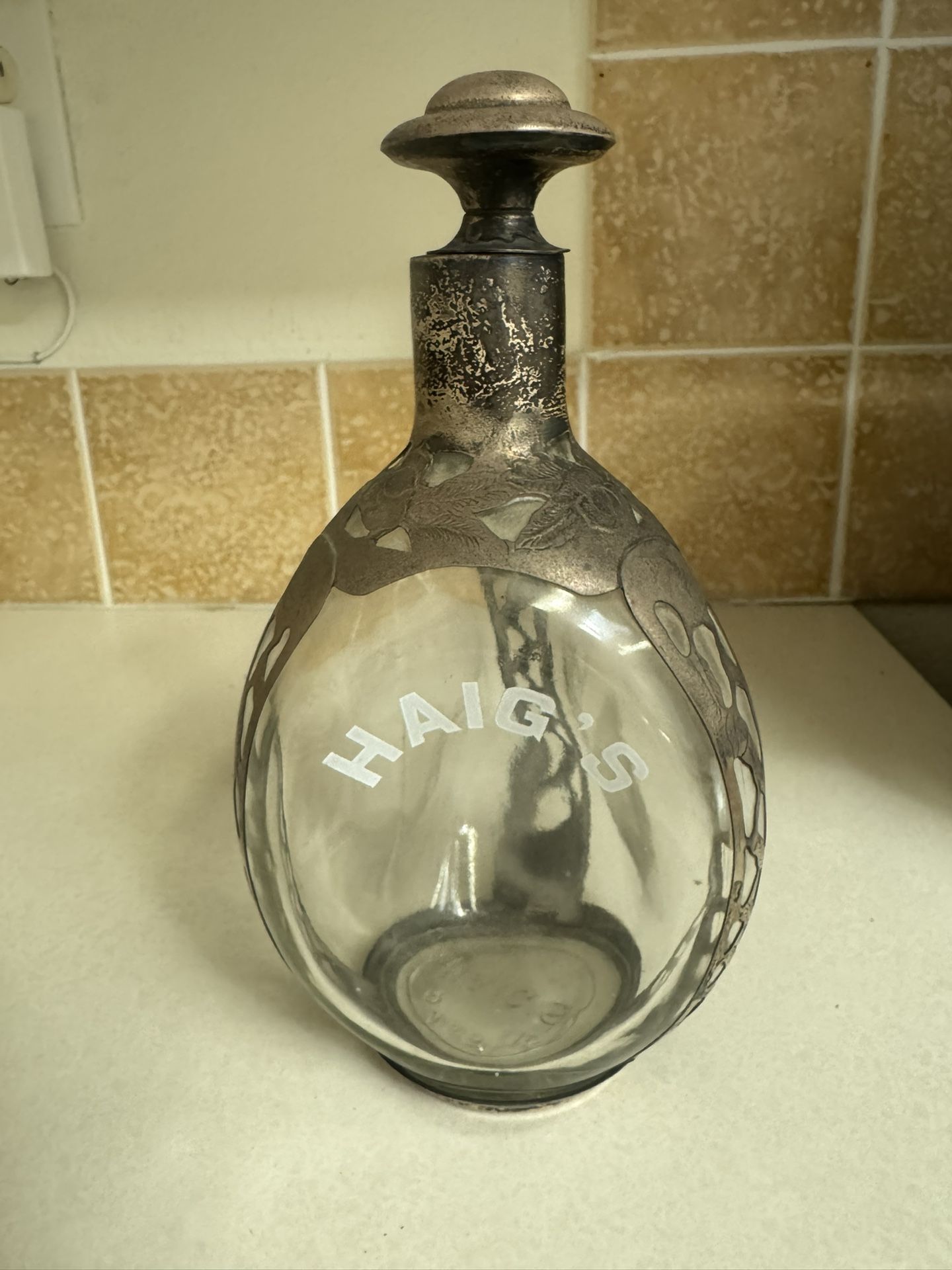 Haig's decanter with a sterling silver overlay