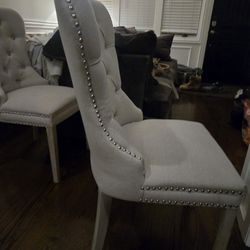 2 creme color dining chairs, silver studded,  great condition