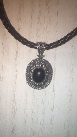 Sterling necklace on leather cord