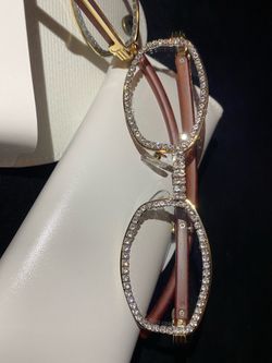 One (1) Millionaire Celebrity French Unisex wooden frame with sparkling lab, diamond ice trim. Comes with a white protective case for secure storage. 