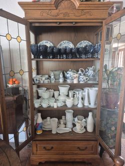 Wooden showcase with glass dishes