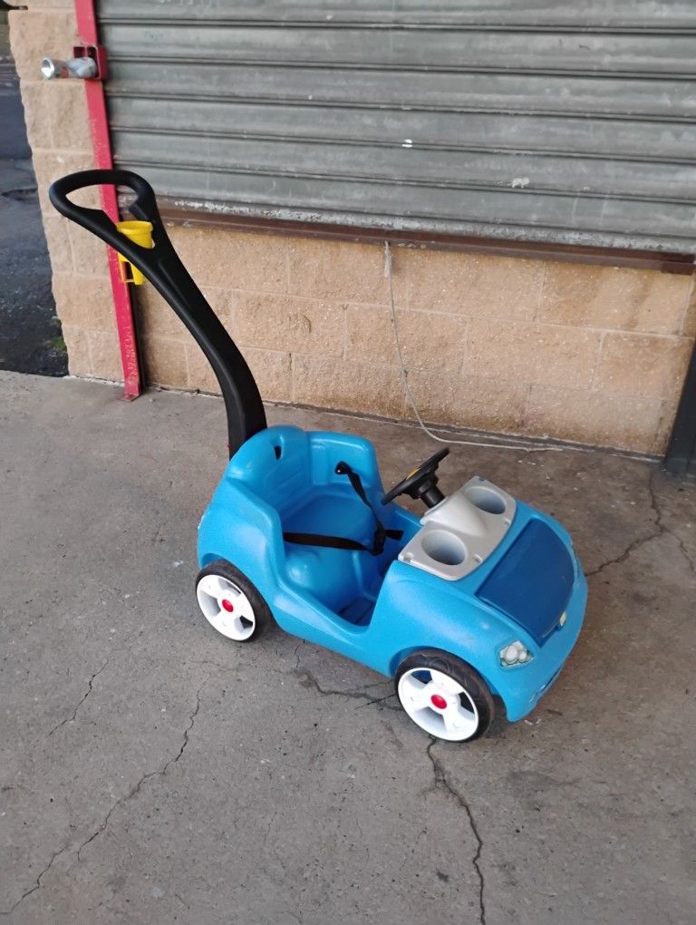 Step 2 push along with seat belt cup holder and handle