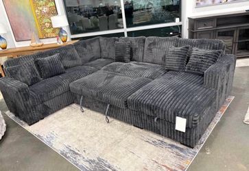 Charcoal Fabric Sectional with Pull-Out Bed and Storage Chaise. Brand New.