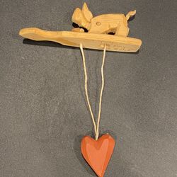 Vintage 1980s Folk Art Hand-Carved Wood Pig Feeding Toy - Articulate Hand-Held Toy. Signed Dave Stevens 1988. Base measures approximately 5.5” x 1-1/4