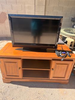 Two pieces of furniture, television and coffee maker