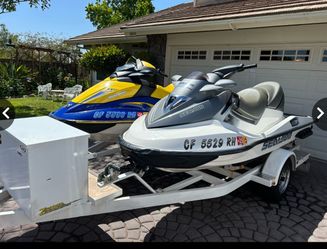 Two 2006 sea doos plus trailer and accessories