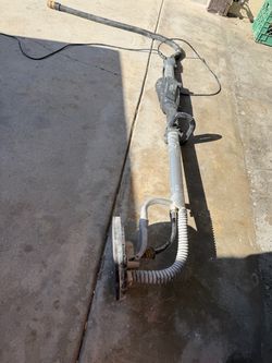 Drywall sander with vacuum hose
