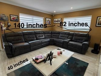 Large leather sectional couch with 2 recliners