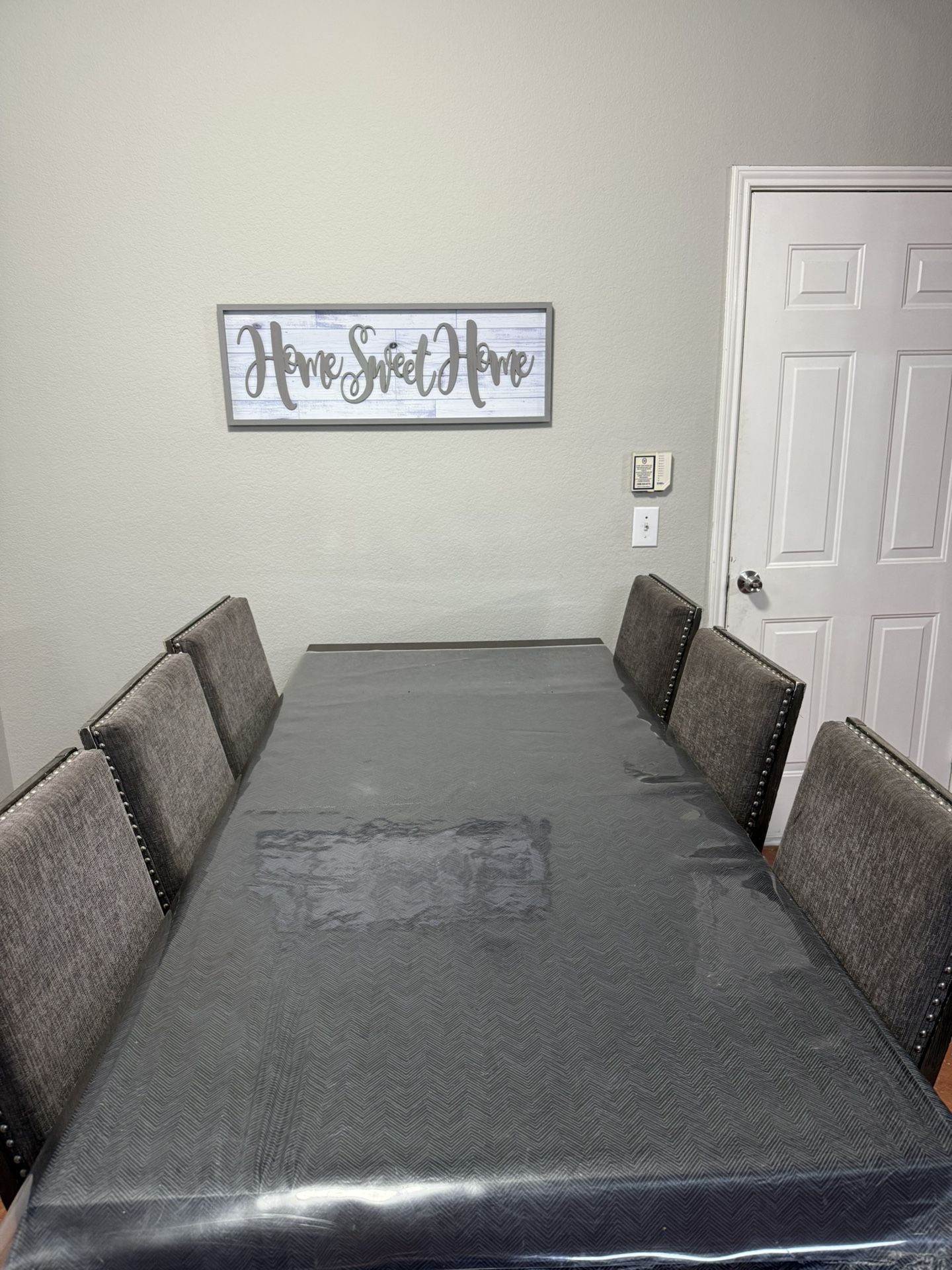 Dining table with six chairs, grey color, good condition