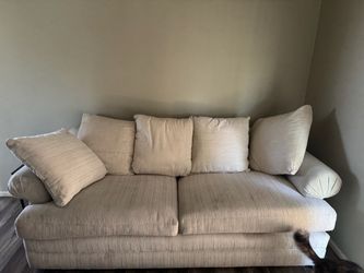 Beige Fabric Two-Seat Sofa with Pillows and mattress inside (futon)